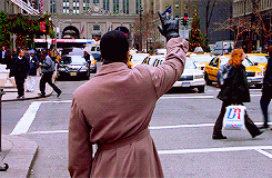 man waving at an elf gif